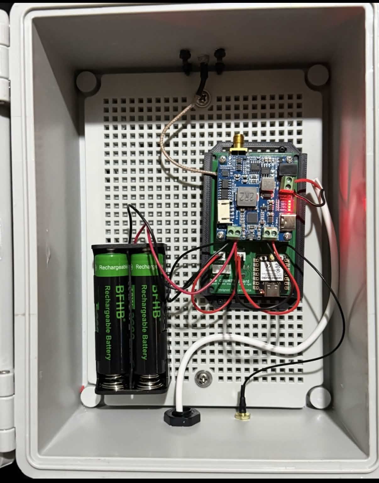 Inside view of a repeater enclosure showing the electronics and batteries